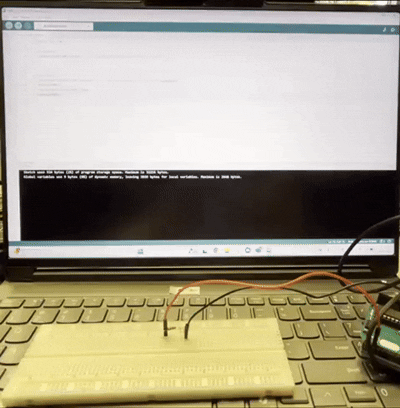 Switch to the Arduino sketch for oneLedonoffactivity14, and connect the LED, black wire, and red wire to the white board for testing.
